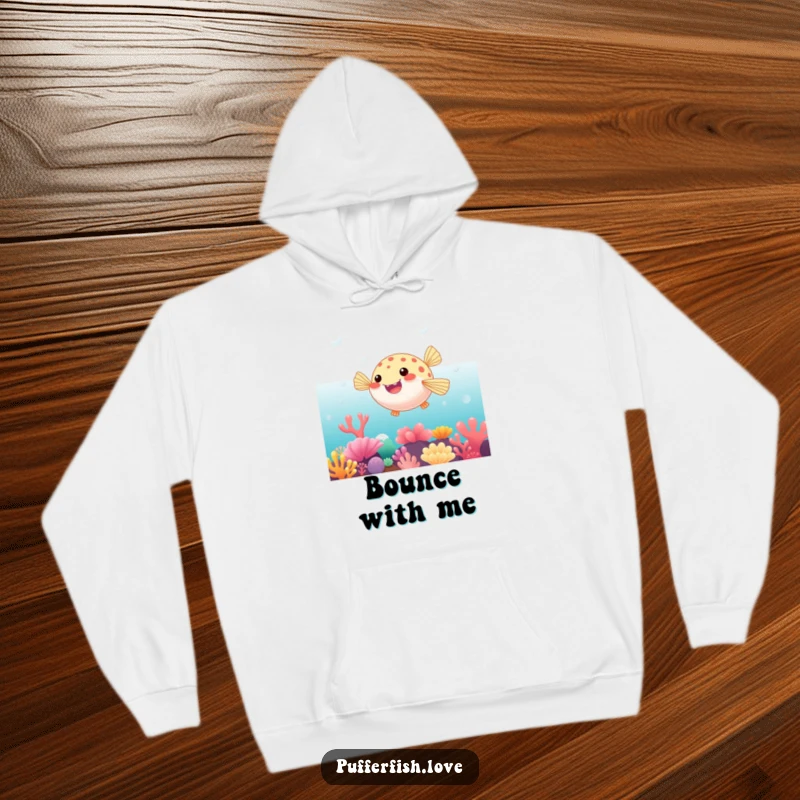 Funny Hoodie of a pufferfish playfully bouncing on a vibrant coral reef, offering warm comfort and a splash of ocean joy.